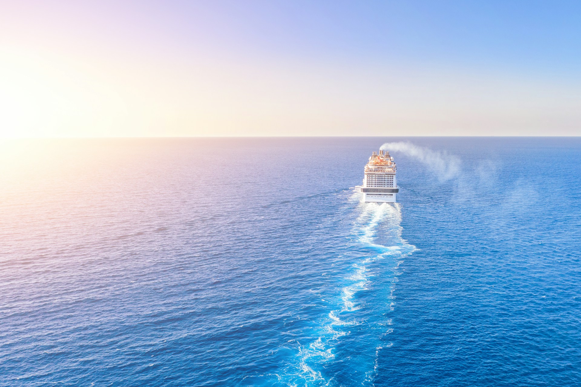 Cruise Ship Sailing off Into Sunset