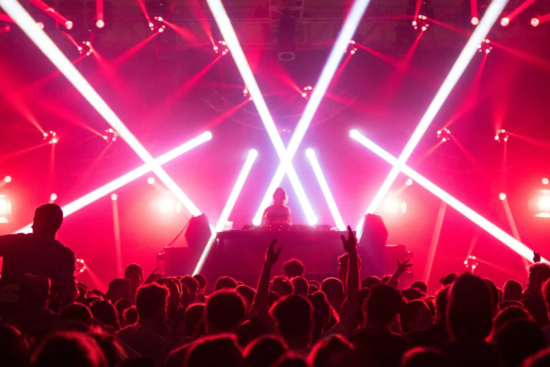 People Dancing at Nightclub with DJ