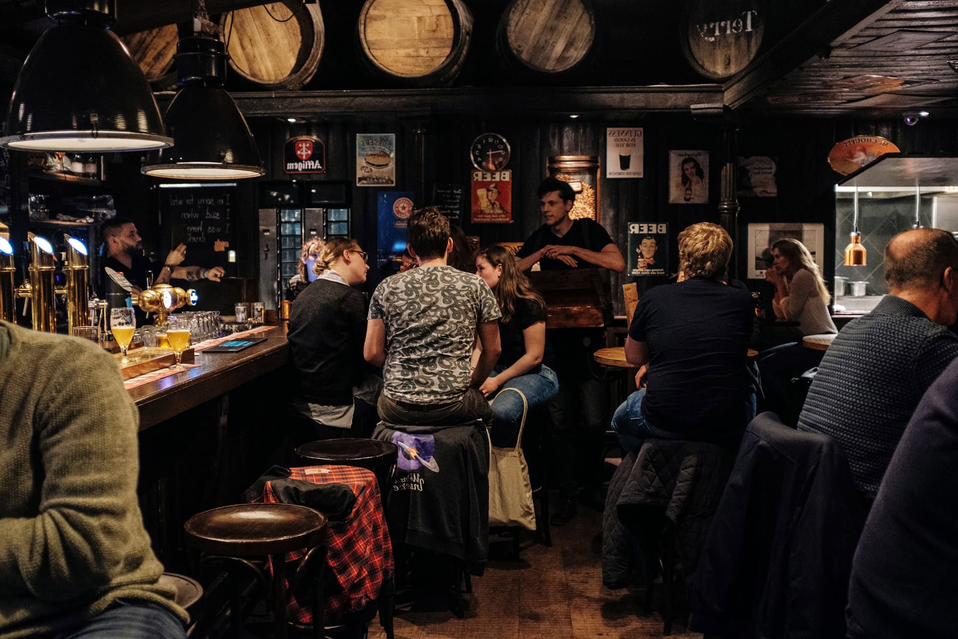People Sat Inside A Pub
