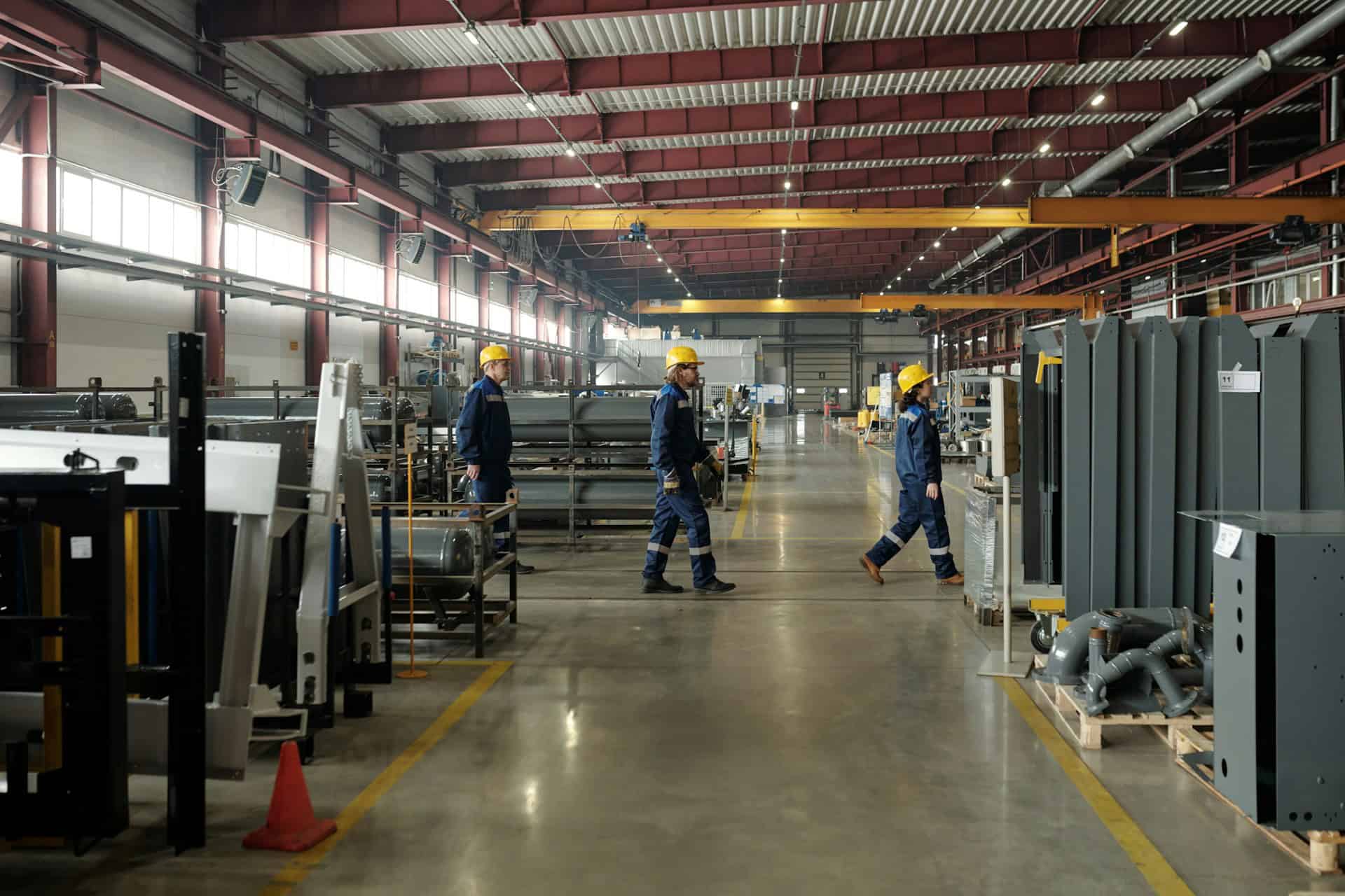 Three Workers Inside Factory