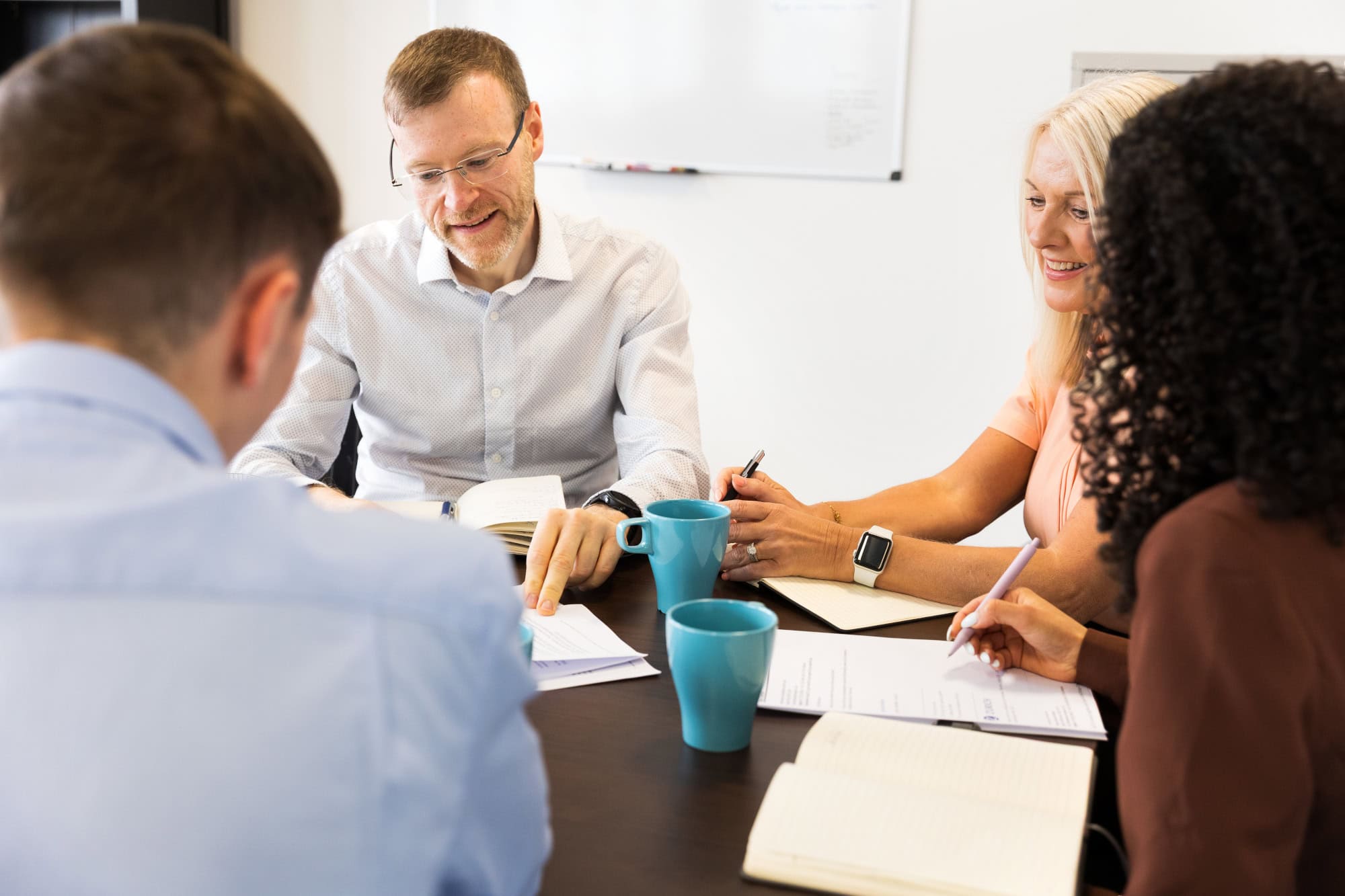 Aequitas Team Reviewing Paperwork